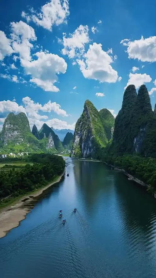 River winding between green karst mountains in China
